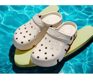 Detailed shot of white breathable casual beach clogs resting on a poolside surface