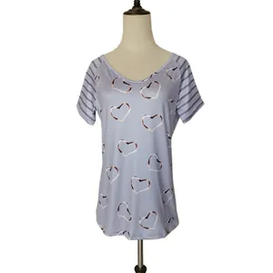 Front view of a purple short-sleeved t-shirt with heart print on a mannequin