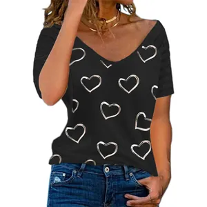 Close-up detail showing the silver heart print on a black short-sleeved T-shirt for women.