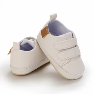 Soft white faux leather infant walking shoes with double velcro straps for 0-12 months