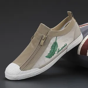 Men's breathable mesh casual shoes featuring a side zipper and green feather embroidery