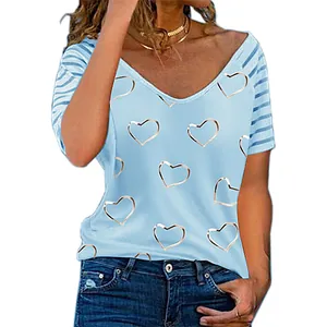 Detail view of light blue V-neck top featuring heart print and striped sleeves
