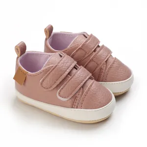 Detail view of pink baby pre-walker shoes with soft leather and velcro straps