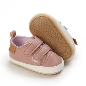 Close-up view of soft-soled baby walking shoes with an anti-slip pebble texture