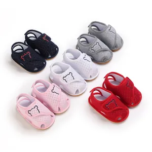 Detailed view of colorful cartoon bear baby sandals with soft rubber soles