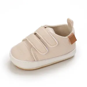 Beige infant soft sole walking shoe with double Velcro straps for babies