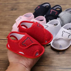 Close-up of soft-sole baby cartoon sandals in multiple colors for infants aged 0-1