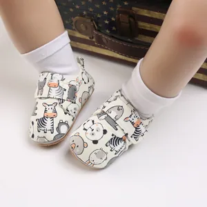 Soft-soled cartoon baby shoes with velcro closure and cute animal prints for infants