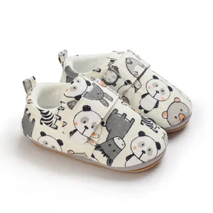Adorable cartoon animal print baby walking shoes featuring soft soles and velcro straps