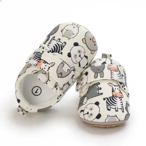 Detailed view of cute animal print baby walking shoes with soft soles and velcro strap