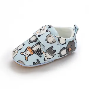 Detail of soft-sole cartoon animal print baby shoes with velcro closure