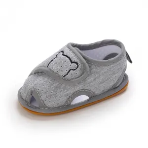 Detailed view of breathable grey mesh baby walker shoe with soft sole and bear embroidery