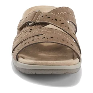 Front view detail of women's brown platform slide sandal with laser-cut decorative patterns