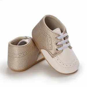 Close-up of champagne gold baby walking shoes with white soft anti-slip rubber soles