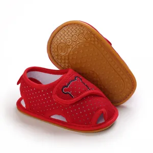 Red baby toddler sandals with cartoon bear embroidery and non-slip rubber sole detail view