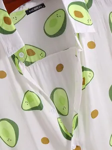 Detail view of men's casual beach shirt featuring cartoon avocado print patterns