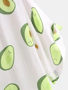 Macro view showing the detailed fabric texture and cute avocado print on a white beach shirt