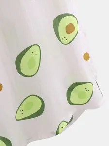 Detail macro shot of white Hawaiian shirt fabric with cute smiling avocado print