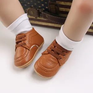 Close-up of brown baby walking shoes with soft non-slip soles and elastic laces