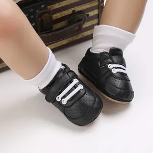 Zapatillas negras para bebé con cordones blancos y suela blanda antideslizante