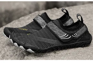 Detailed close-up view of black breathable mesh water shoes with geometric pattern strap