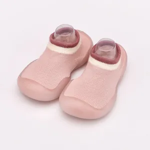 Detailed view of pink breathable baby sock shoes with flexible soft soles