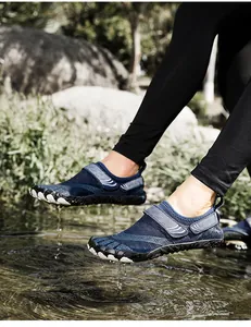 Action close-up of blue five-finger water shoes for outdoor river tracing and swimming