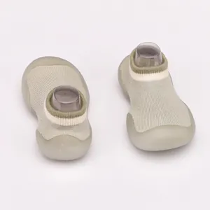 Detail view of breathable sage green baby walking sock shoes with soft non-slip soles