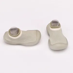 Detailed side and front view of breathable knit baby shoes with soft rubber soles
