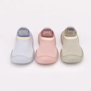 Detailed view of breathable soft-sole baby walker sock shoes in blue, pink and green colors