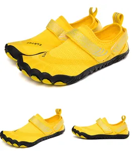 Detailed macro view of yellow quick-dry water shoes featuring a non-slip five-finger rubber sole.
