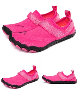 Detail view of pink quick-dry water shoes with breathable mesh and five-toe sole