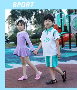 Outdoor scene showing two children wearing colorful wading beach shoes on a playground.