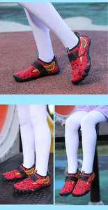 Macro view of children's red water shoes with durable non-slip soles and velcro straps