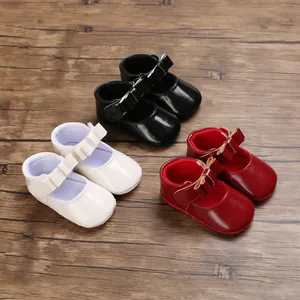 Selection of baby girl patent leather Mary Jane shoes in black white and red colors
