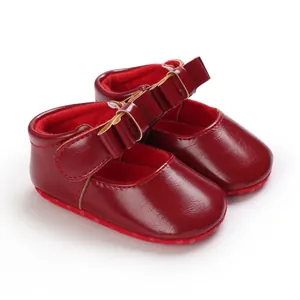 Detailed view of elegant red baby girl princess pre-walker shoes with stylish bow straps