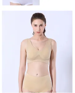 Front view of a breathable nude mesh sports bra and matching shorts on a professional model