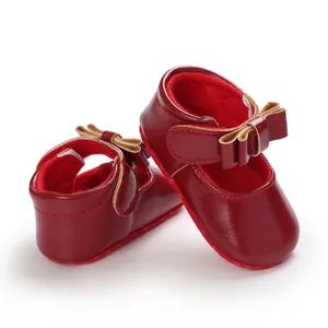 Elegant red baby girl Mary Jane shoes with a lovely bow detail for infant walkers