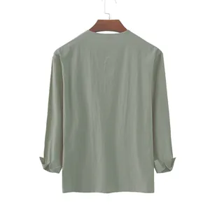 Detailed back view of men's loose sage green cotton linen long sleeve shirt on hanger