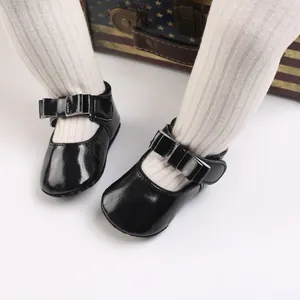 Elegant black patent leather baby princess shoes with stylish bow detail for toddlers