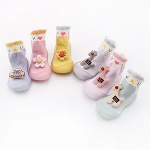 Detailed view of colorful cartoon baby walker shoes with soft soles and cute 3D decorations