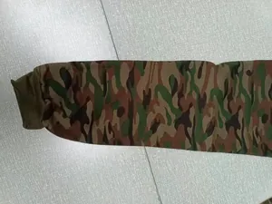 Close-up detail of camouflage pattern and ribbed cuff on men's athletic jogger pants