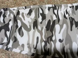Detailed close-up showing the grey and white camouflage pattern of men's gym joggers.