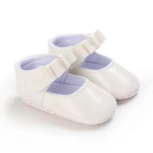 Detail of cream white baby girl Mary Jane princess shoes with bow and soft soles