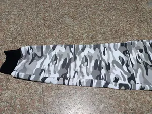 Detail shot of men's white and grey camouflage joggers with black ribbed cuffs