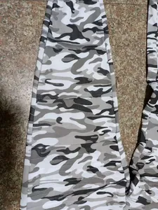 Detailed view of gray camouflage joggers for men featuring a unique tiered leg design