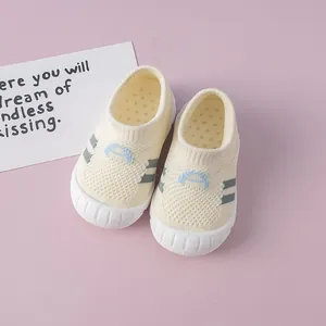 Detail view of breathable flyknit baby walking shoes with soft white soles