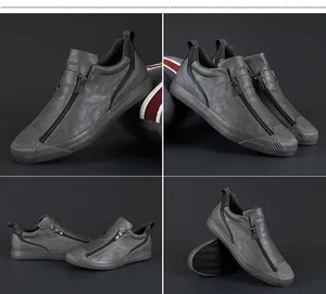 Umfassende Detailansichten grauer Herren-Freizeitschuhe mit einzigartigem vertikalem Reißverschluss.