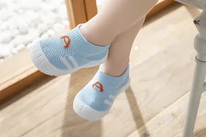 Close-up of breathable light blue fly-knit toddler walking shoes with soft sole