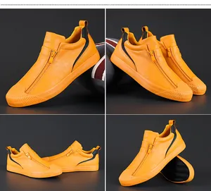 Detailansicht trendiger gelber Herren-Freizeitschuhe mit markantem Reißverschluss